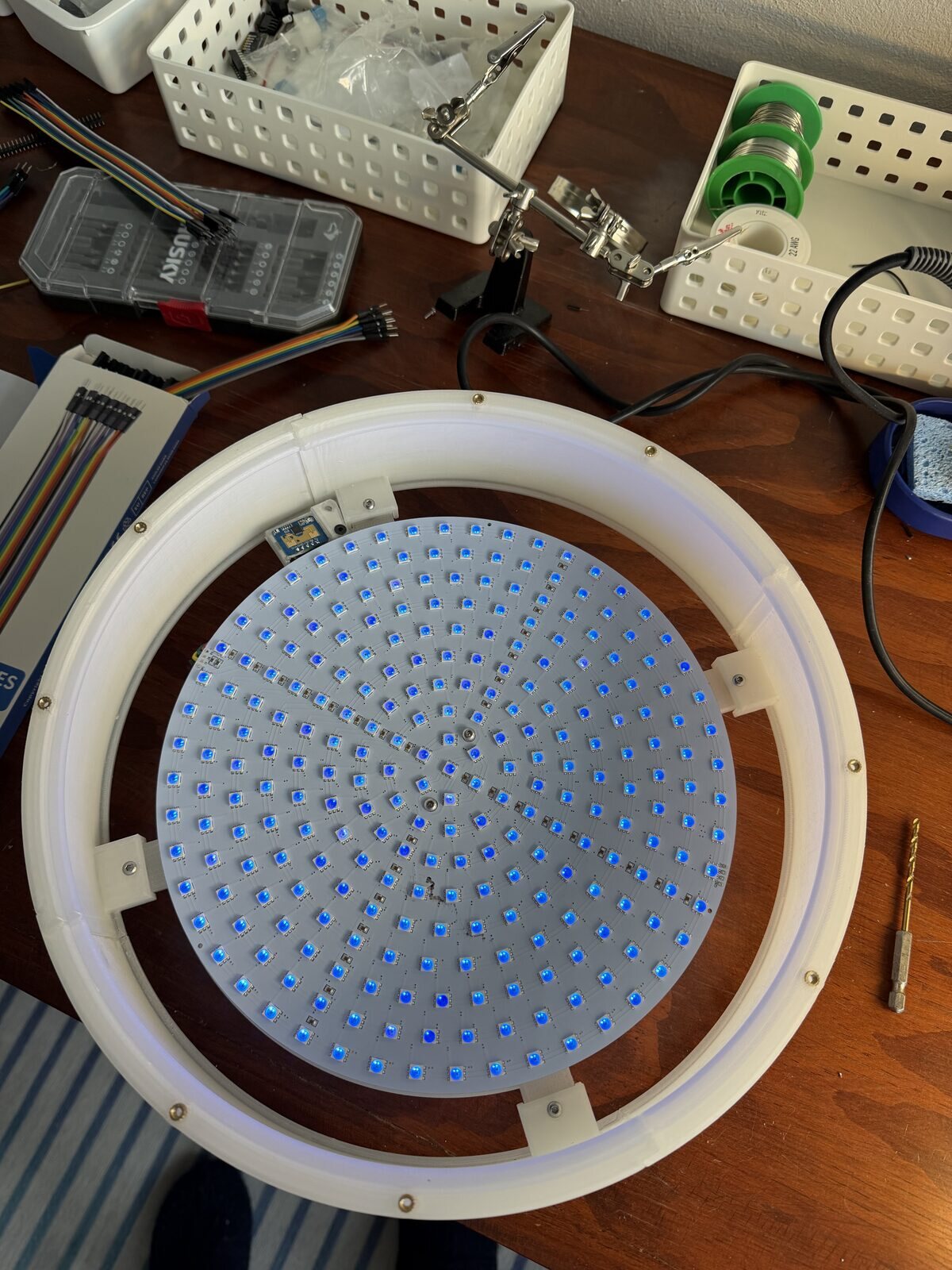 The LED disk sitting in its clear printed wall, no glass on yet