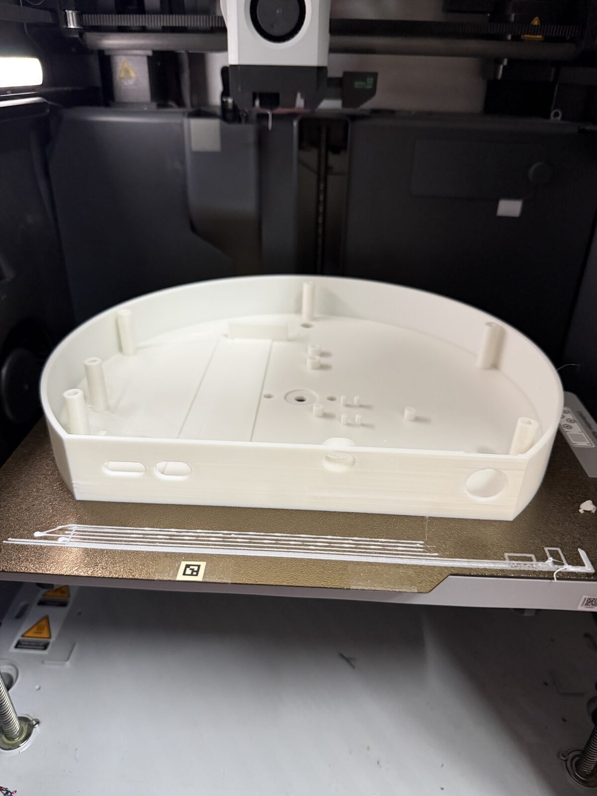 A white printed back box just off the printer