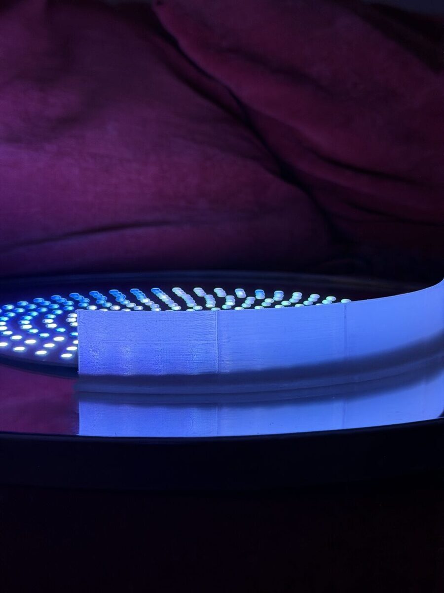 A sanded strip of clear printed wall glowing evenly