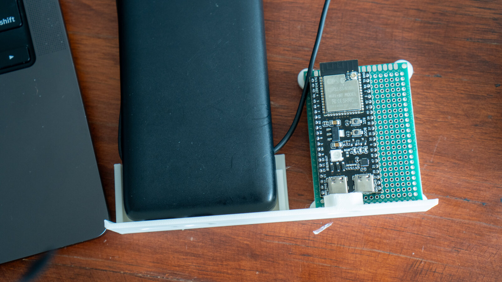 The battery and the ESP32 board on a printed tray