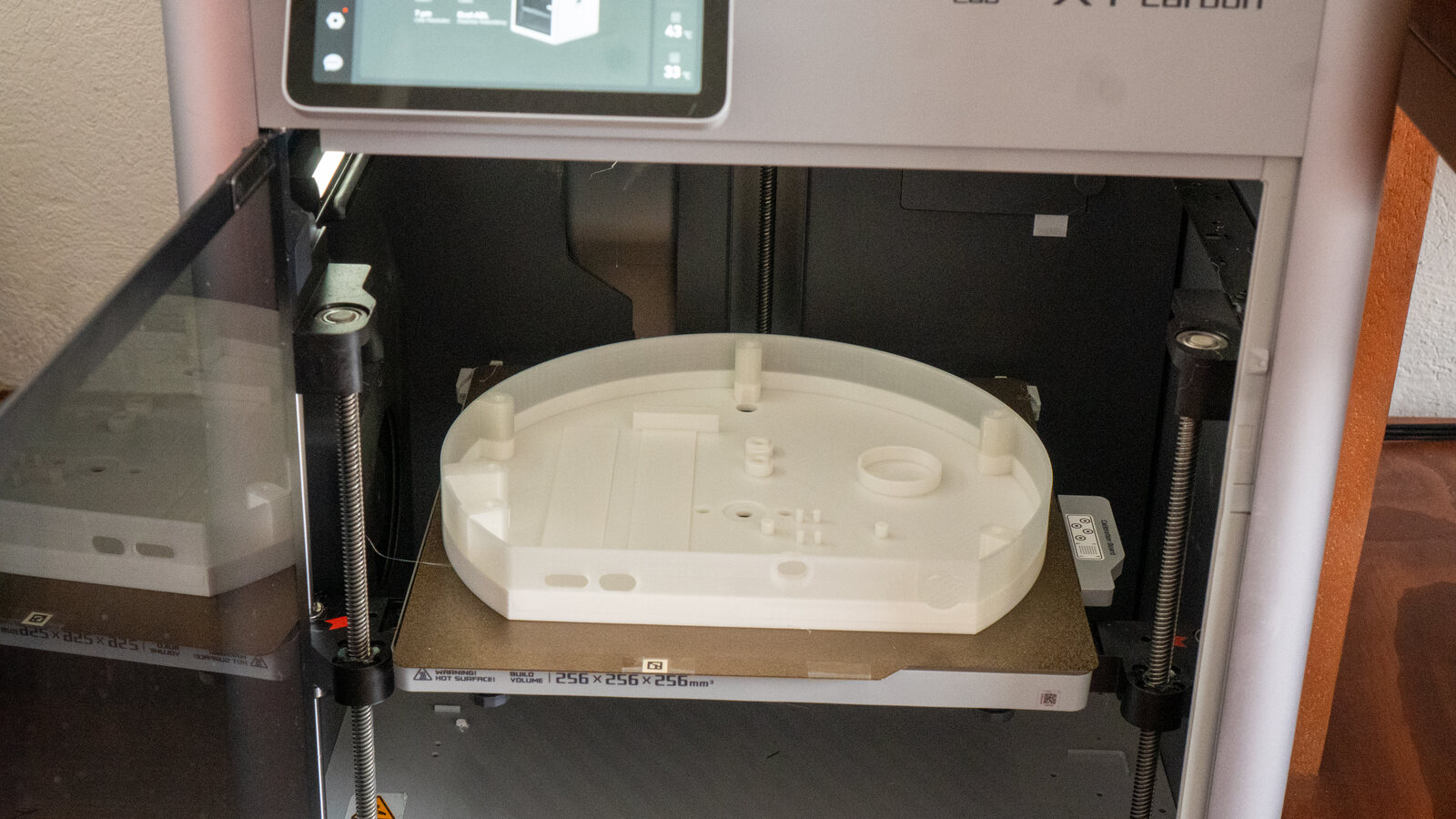 A printed back box, white fading to clear, coming off the printer
