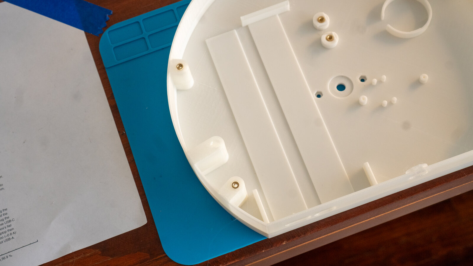 The back box with brass inserts set in its posts