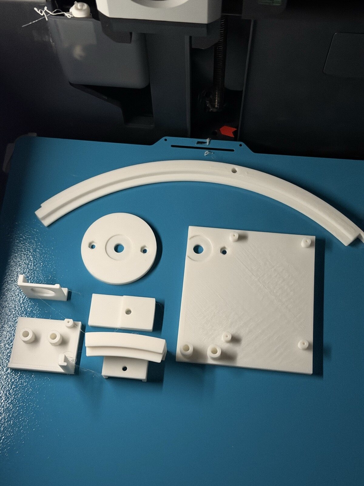 A tray of small clear test parts