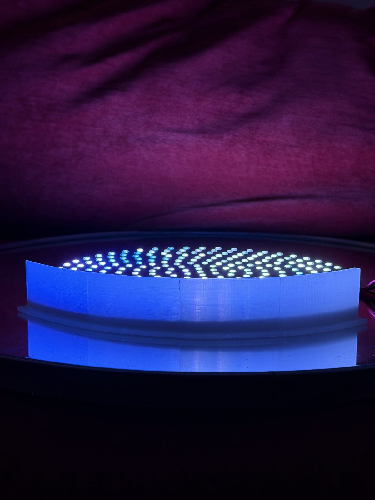 A sanded clear test strip glowing evenly on the disk