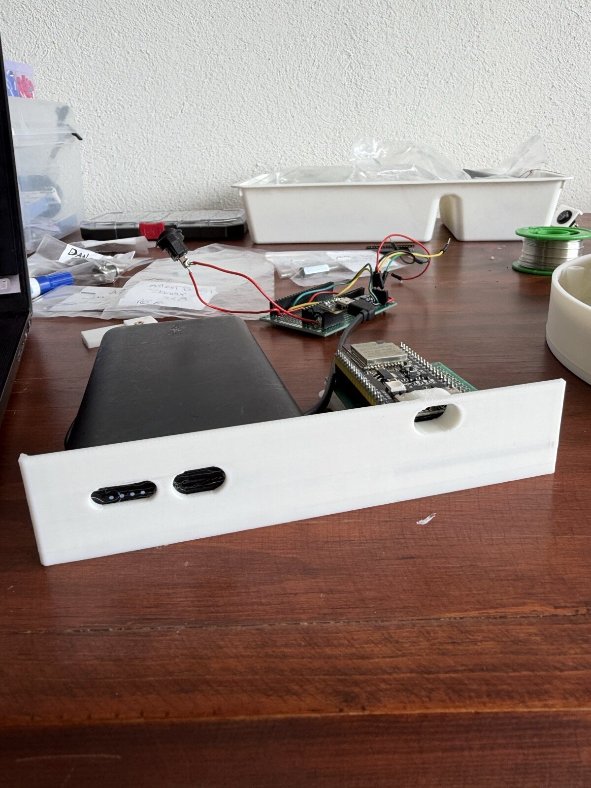 A test print of the bottom wall with the battery behind it