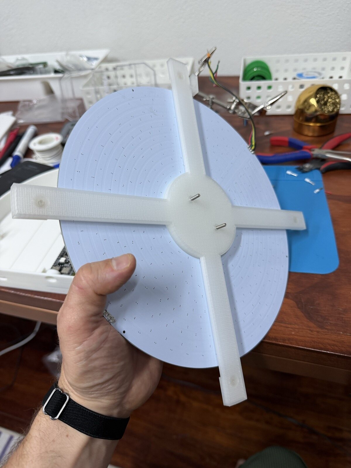 The LED disk sitting on the clear printed legs